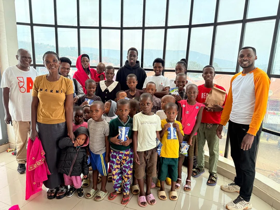 BaBra Foundation community gathering with children, families, and volunteers in Rwanda